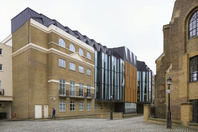 A highly-detailed zinc roof and cladding, creating a striking modern design. A highly-detailed zinc roof and cladding, creating a striking modern design.